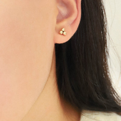 Gold stud earrings