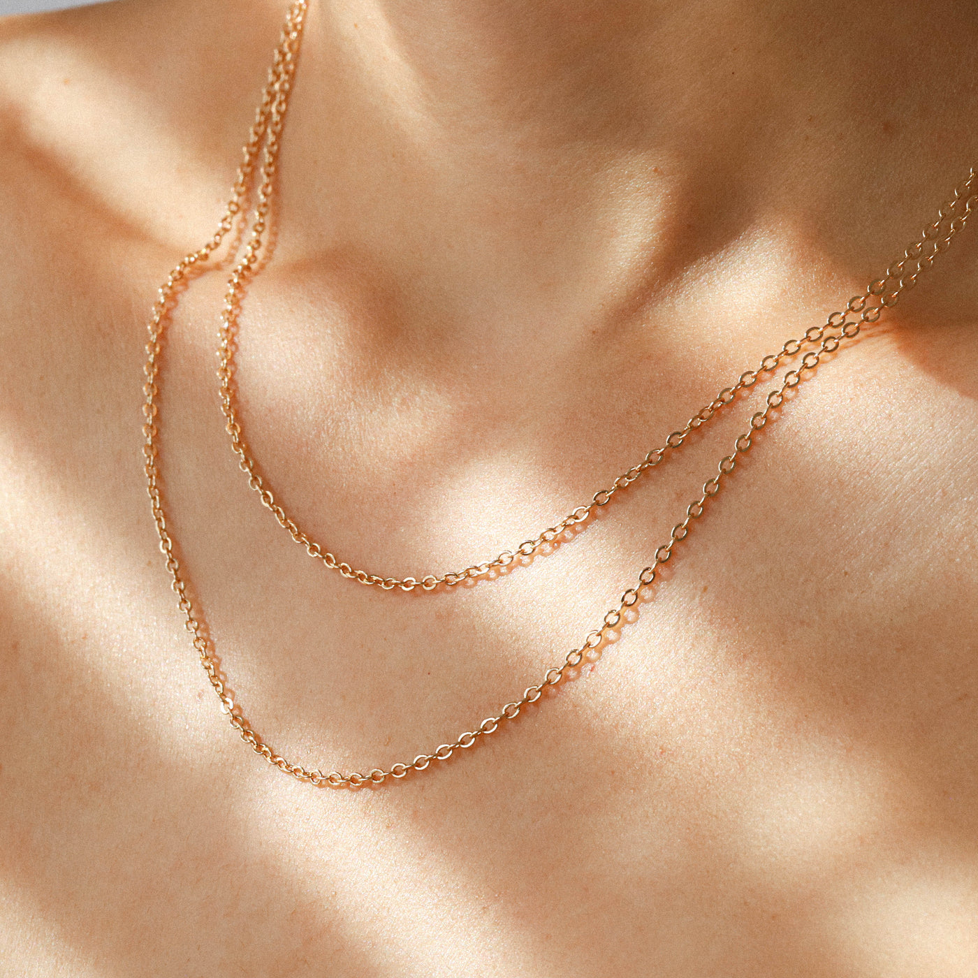 Layered gold chain necklaces