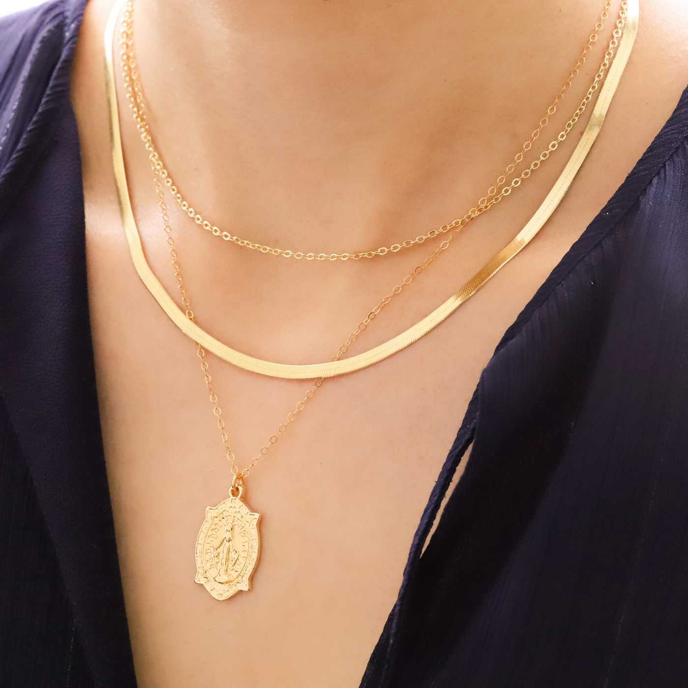 Layered gold necklaces