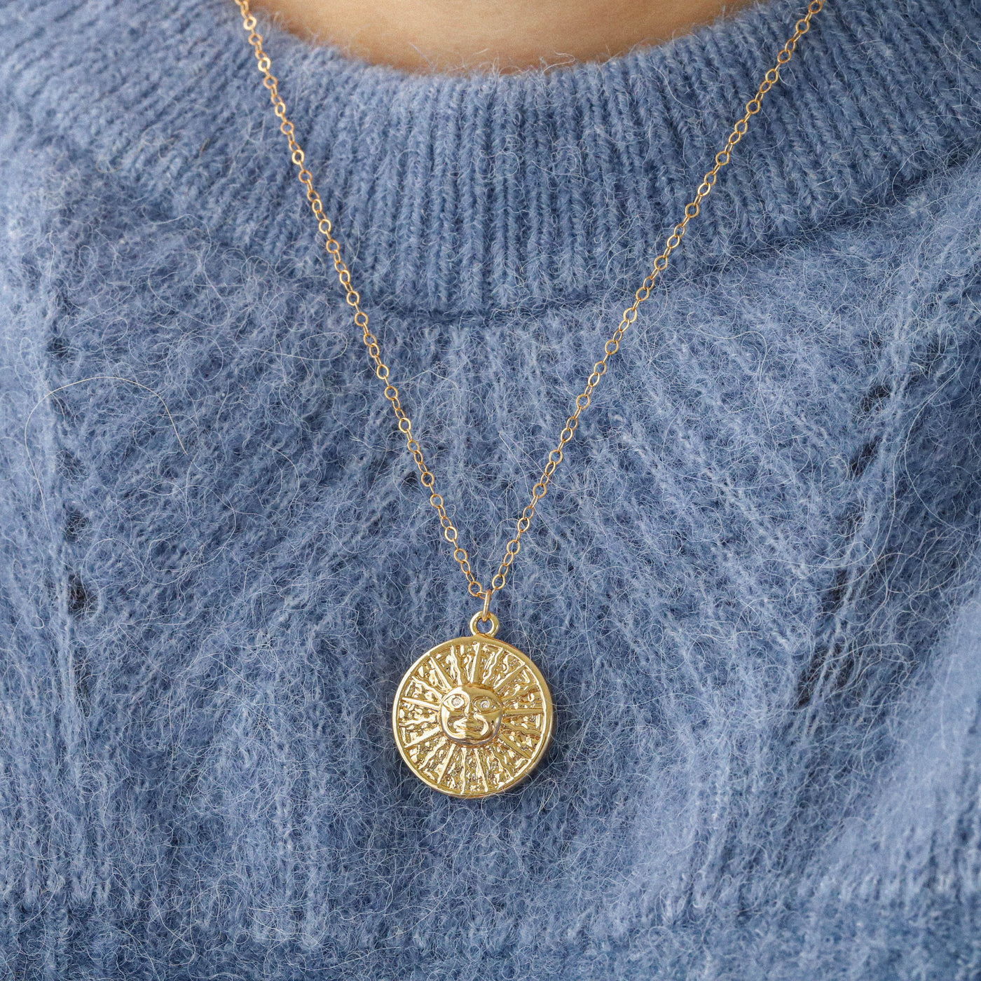 Gold sun face pendant necklace